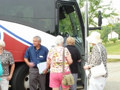 Members getting on the bus to Middletown.